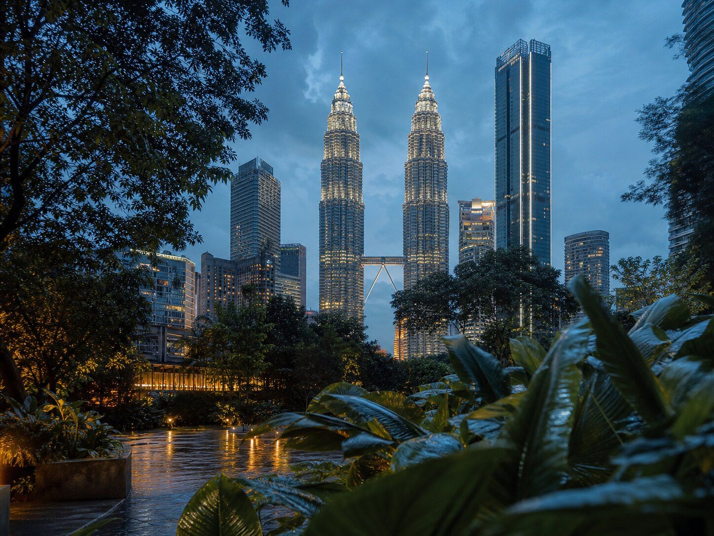 Kuala Lumpur skyline framed by tropical greenery